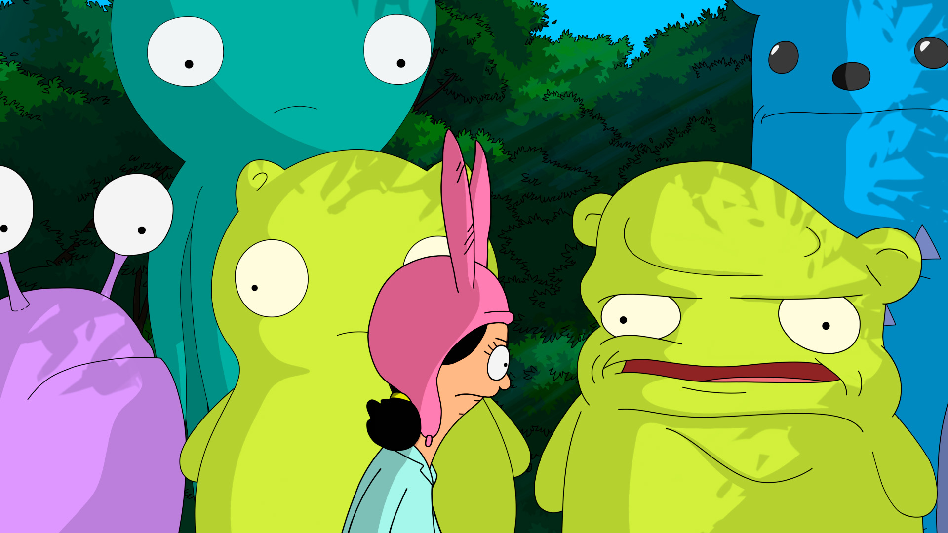 Louise stares down at the ground looking determined surrounded by life size versions of her stuffed animals while good and bad Kuchi Kopi talk to her.